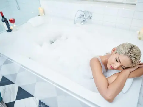 Guest enjoying the private whirlpool bathtub