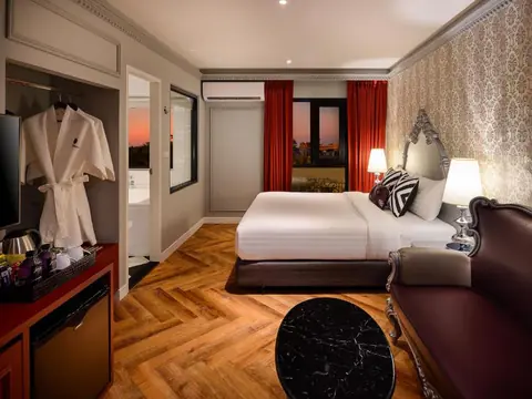 Villa De Khaosan guest room with sunset view